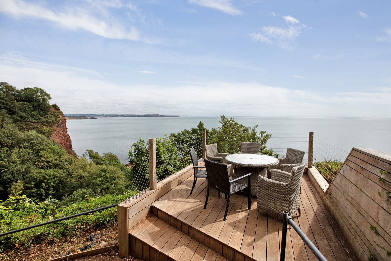 A timber deck terrace at Shell Cove looking out to sea
