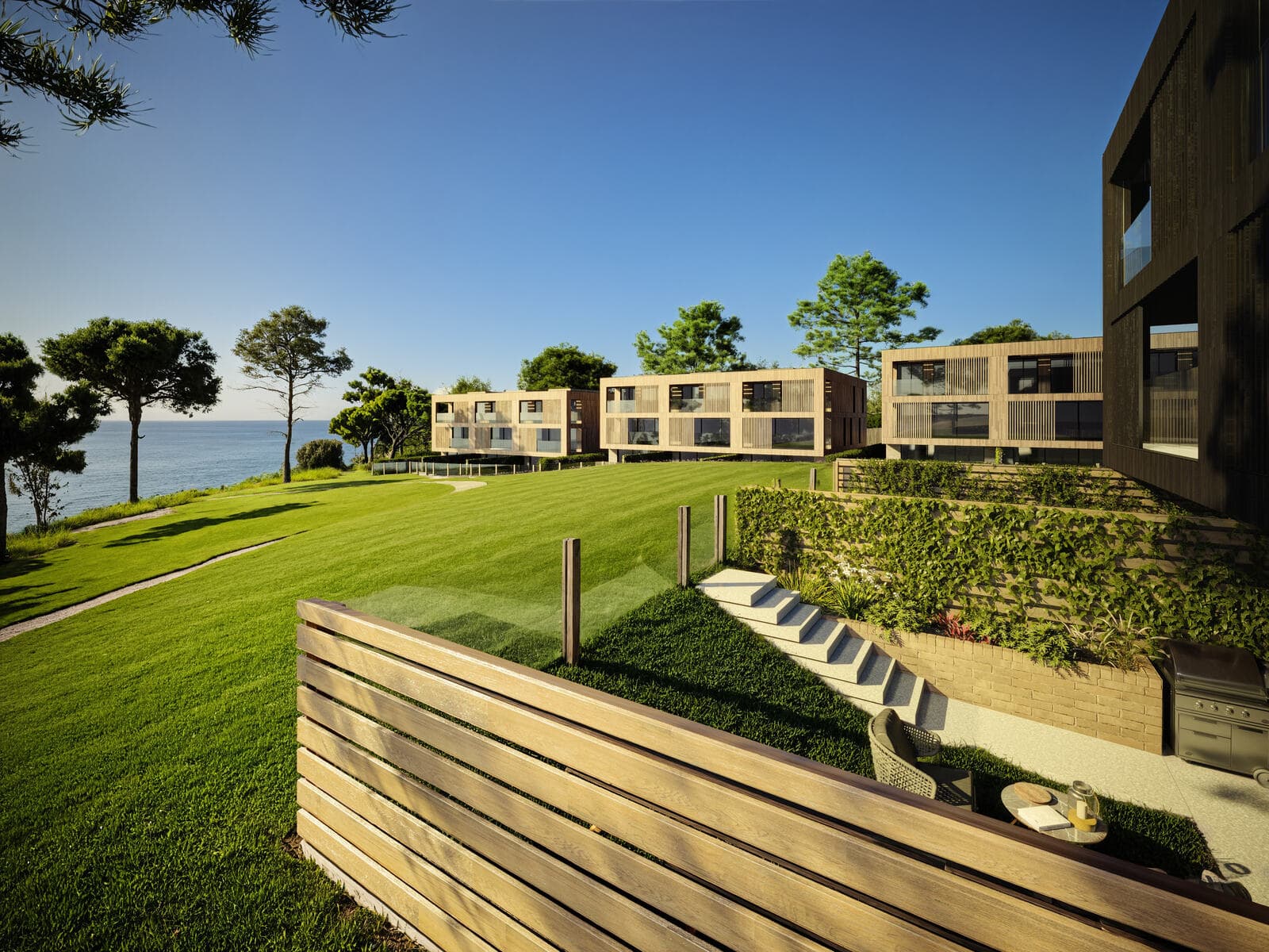 Landscaped lawns and terraces in front of the homes