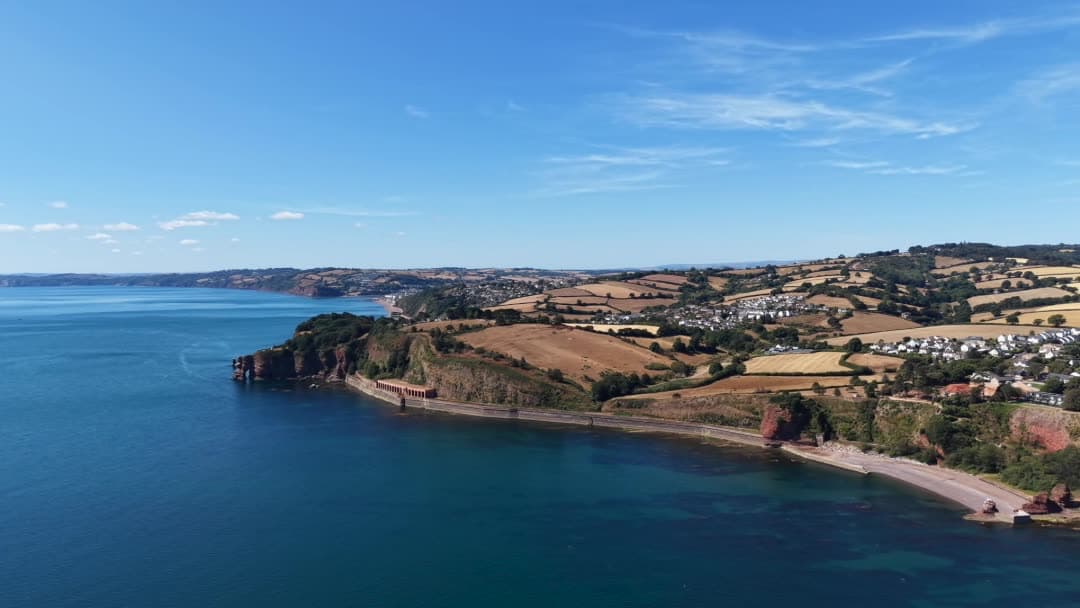 Shell Cove and its cove from the air, the still that opens the film