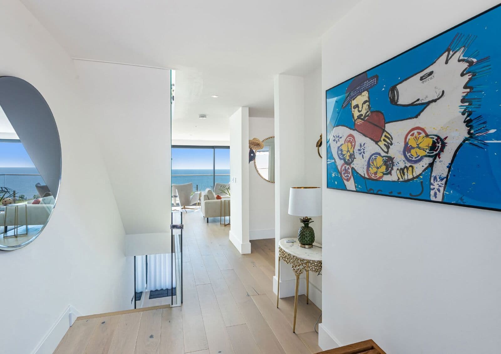 Hallway and living space with views through to the sea